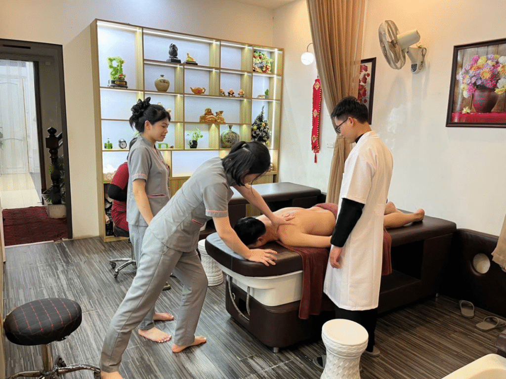 Close-up of hands applying deep tissue technique during a home massage.